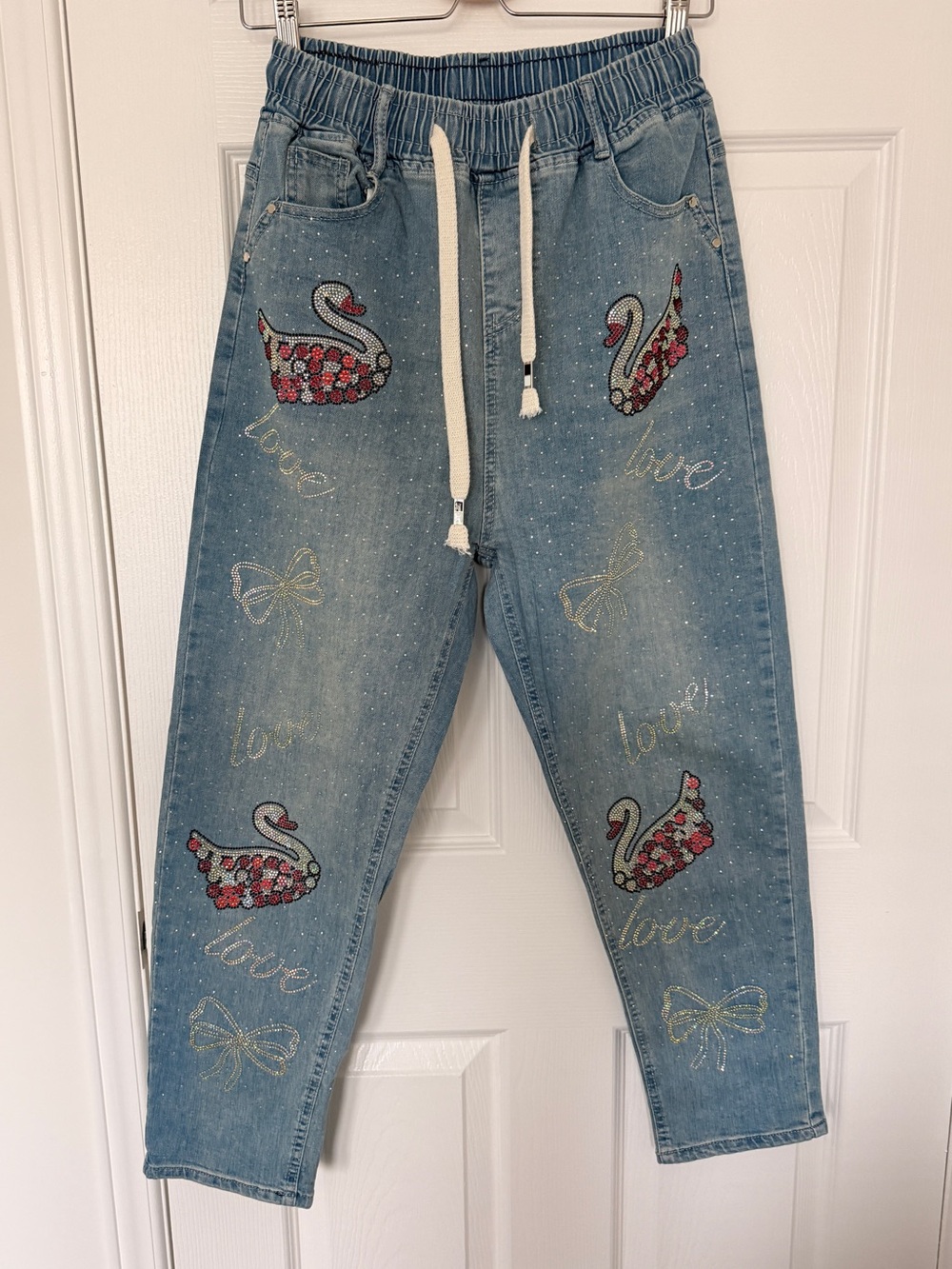 Women's Light Blue Embellished Denim Jeans with Swan Motif